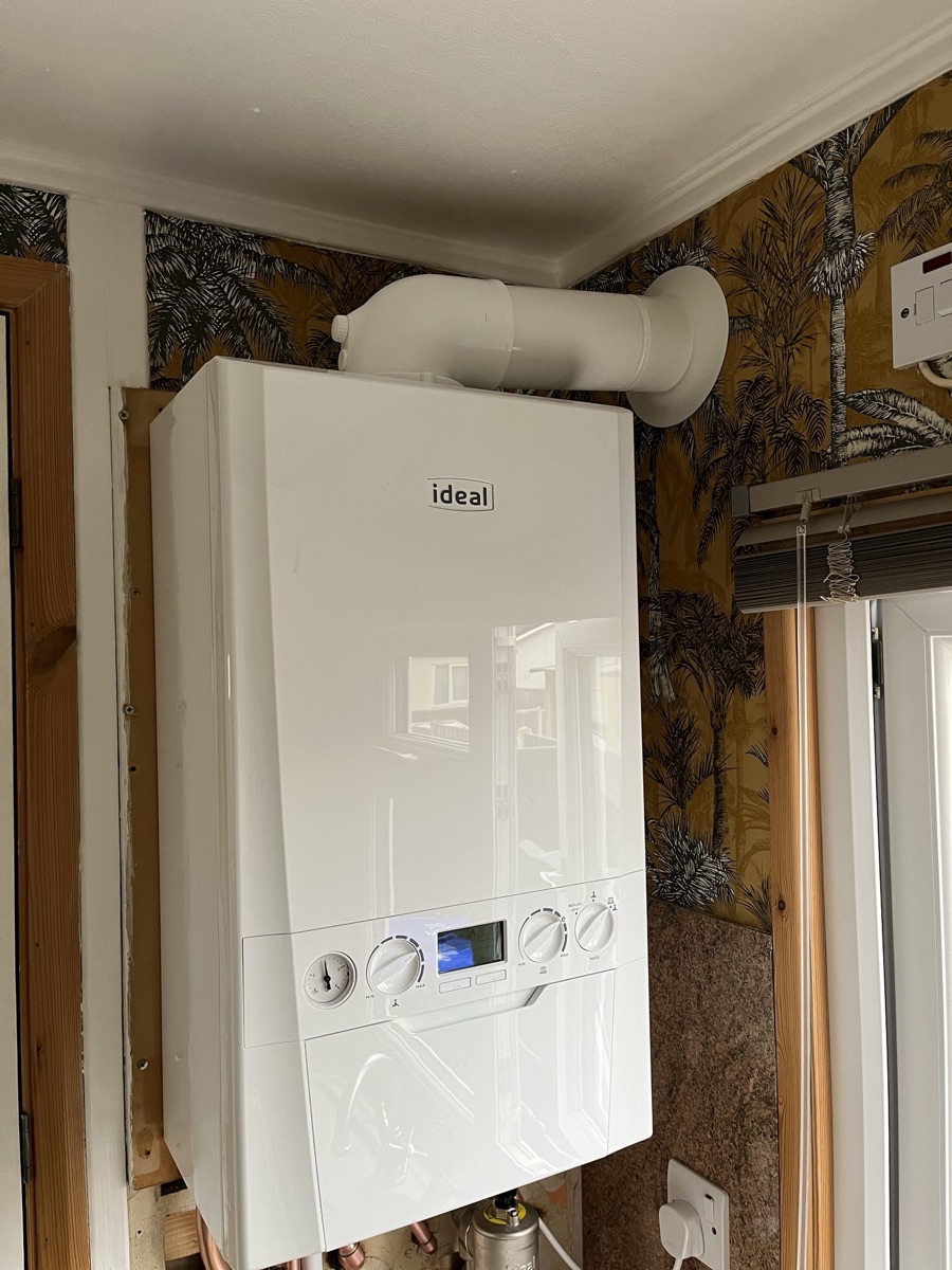 The replacement Ideal boiler fitted in the same position with a new flue