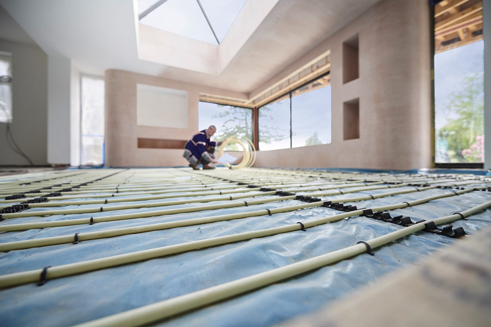 Underfloor heating pipework clipped out across insulation before the floor is laid
