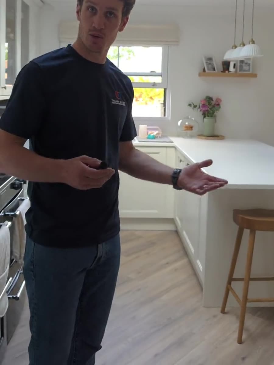 The finished kitchen floor running through to the island, with no radiators on the walls