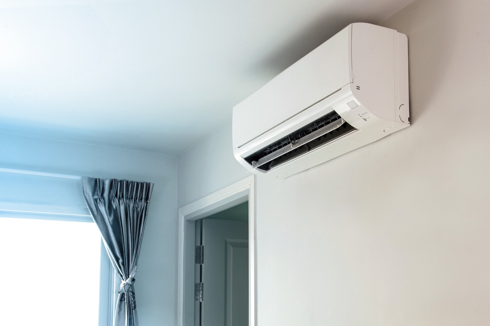 Wall mounted air conditioning unit providing both heating and cooling in a home in Reading